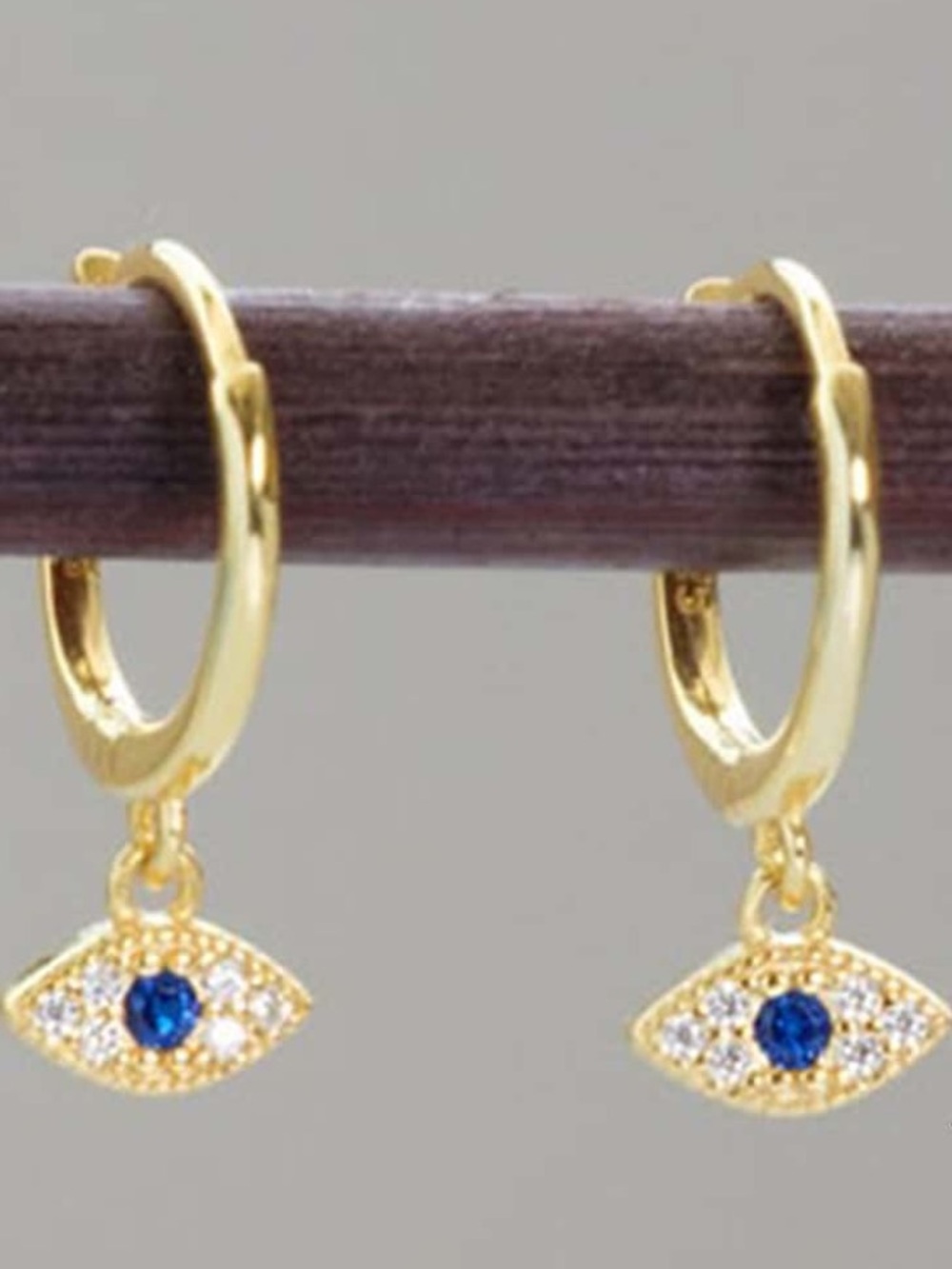 Gold Evil Eye Huggie Earrings with Blue Crystal Accent -